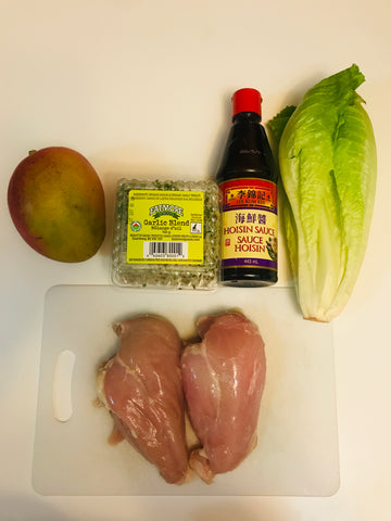 Ingredients of chicken, mango, hoisin sauce, sprouts, and romaine lettuce