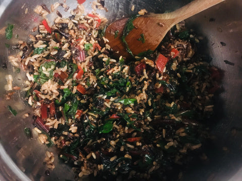 Combined ingredients of a cherry chard wild rice salad