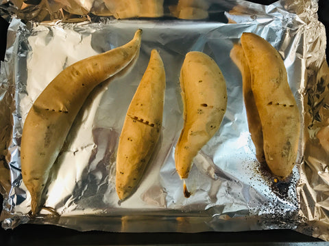 Sweet potatoes on a baking sheet