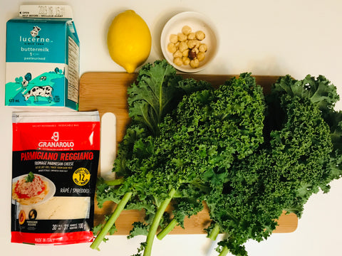 Kale, parmesan cheese, buttermilk, blanched hazelnuts, and a lemon