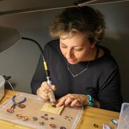 Diana Papazian creates enamel earrings and enamel necklaces in her home studio.