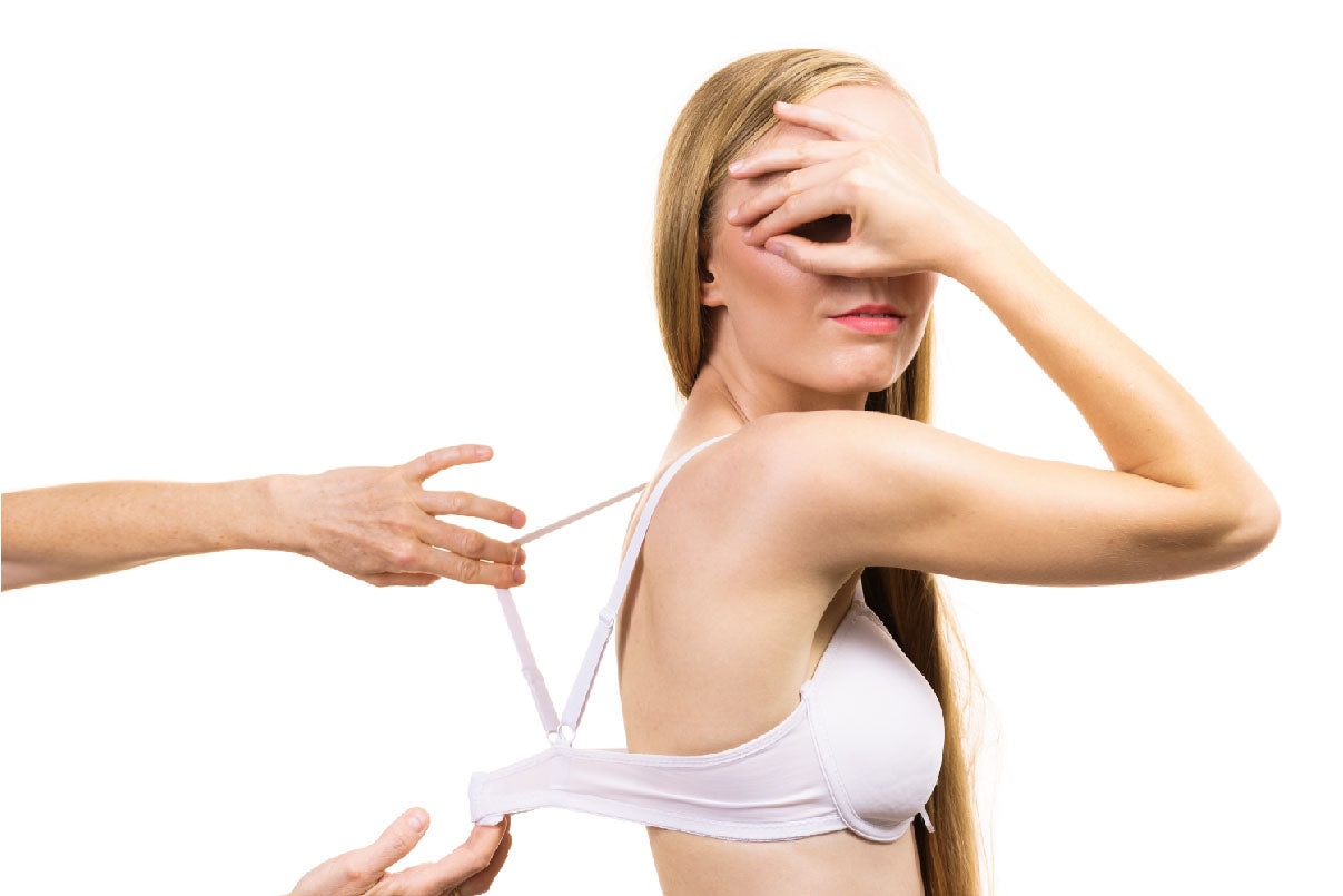 woman checking her breast measurement for fit bra size Stock Photo