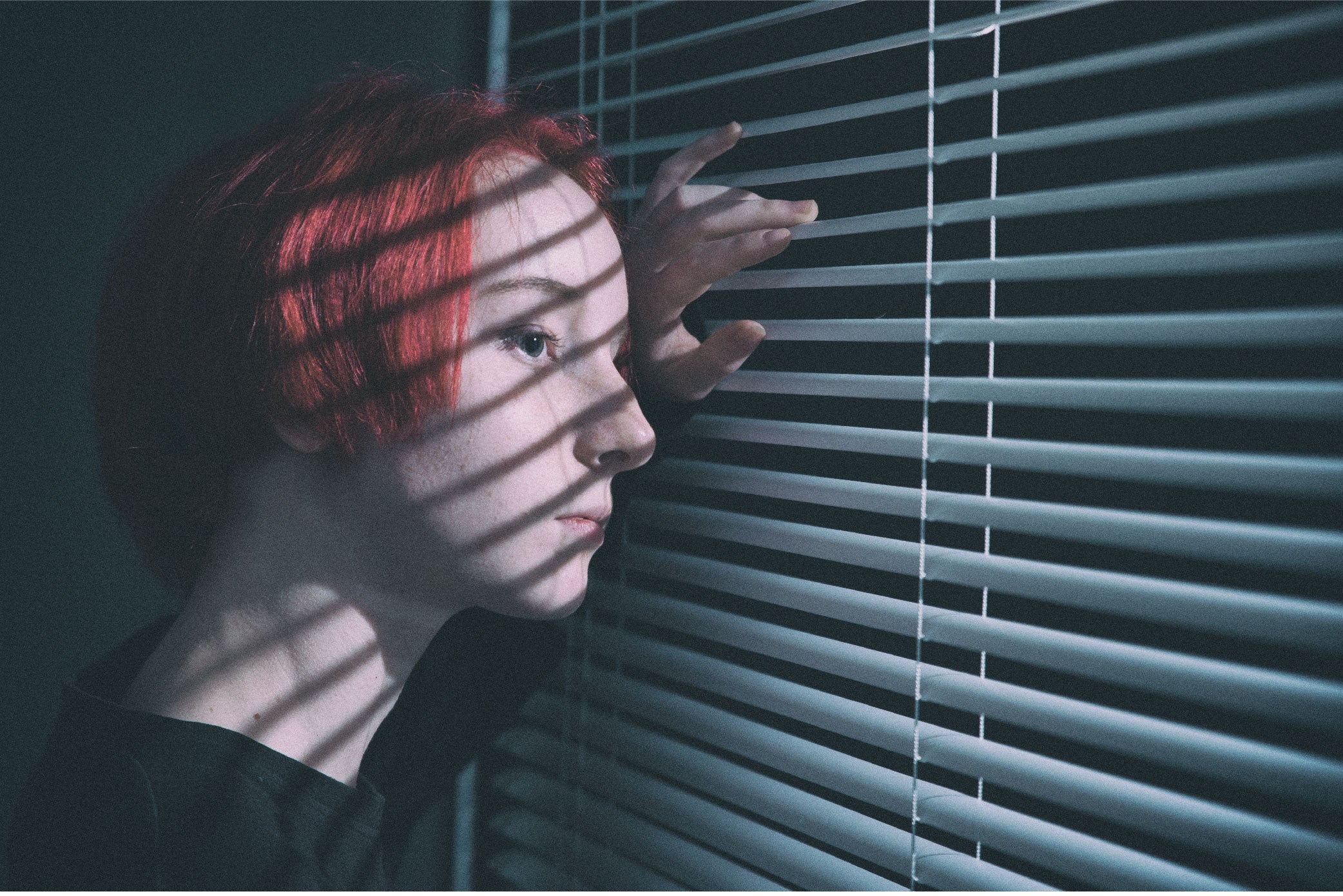 Woman looking out window