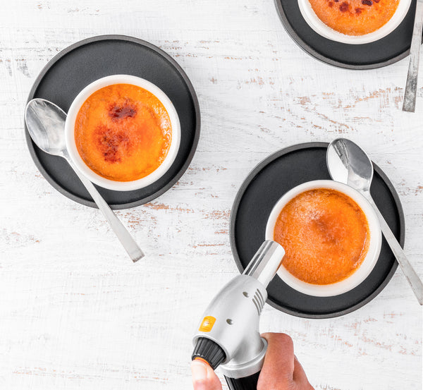 Using a culinary blowtorch on creme brulee