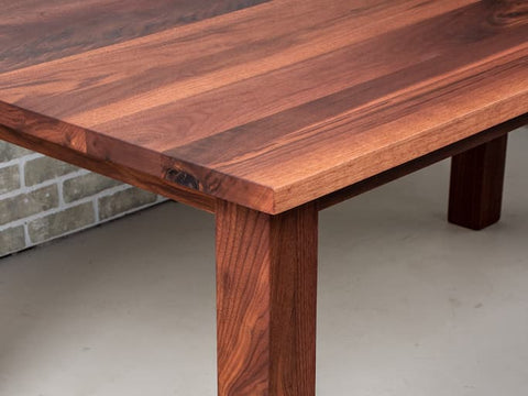 The corner of a dining table with a Seymour Edge