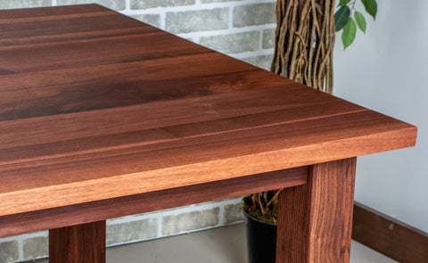 walnut dining table with a spiced finish