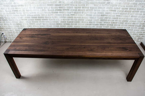 walnut parsons table with blackened finish