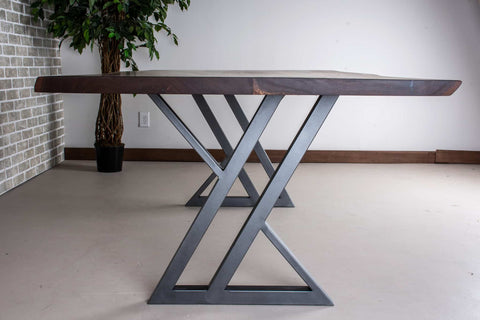 zionz legs in gunmetal under a bookmatch walnut table