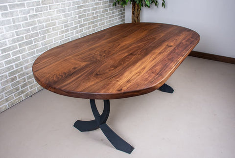 a walnut dining table with a natural finish