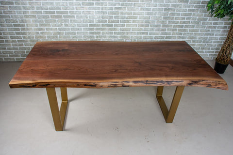 a walnut dining table with a natural finish