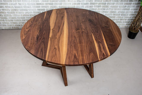 a walnut dining table with a natural finish