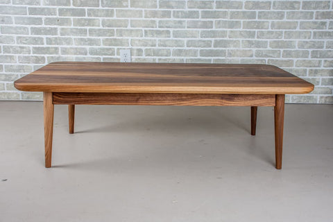 walnut table on a milford base