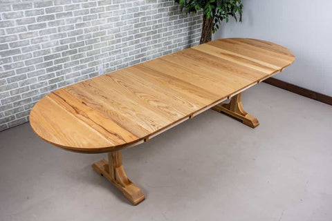 A Natural ash racetrack extension table