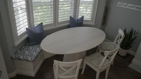 Ellitpical Oval Dining Table in a Bay Window