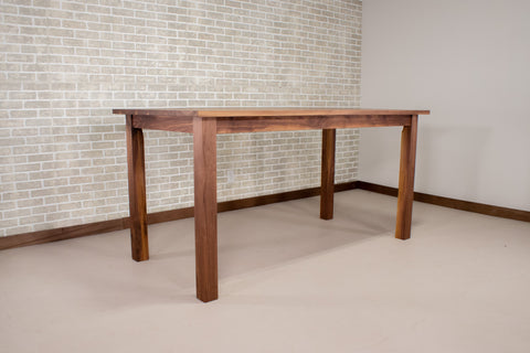 bar height walnut table on a parker base