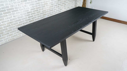 black finish on an oak dining table