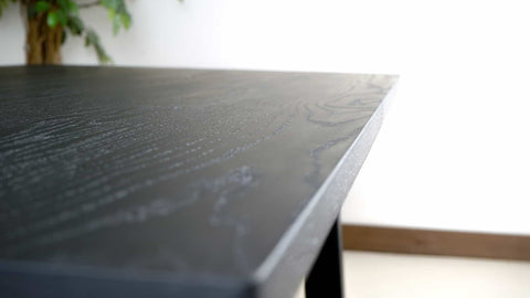 black finish on an oak dining table