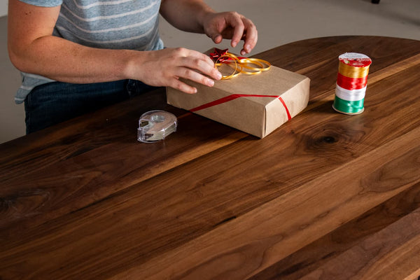 Wrapping a gift on a Coffee Table