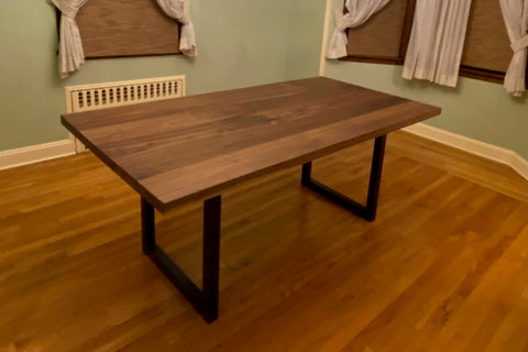 walnut dining table on black steel quarry legs