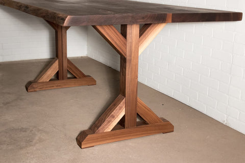 flaxman leg in walnut under a walnut dining table