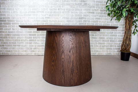 an oak dining table with an espresso finish