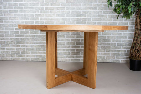 baker base in natural under an oak dining table