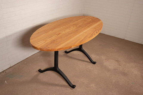 An oval ash dining table