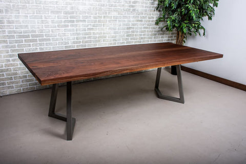 a walnut dining table with a natural finish