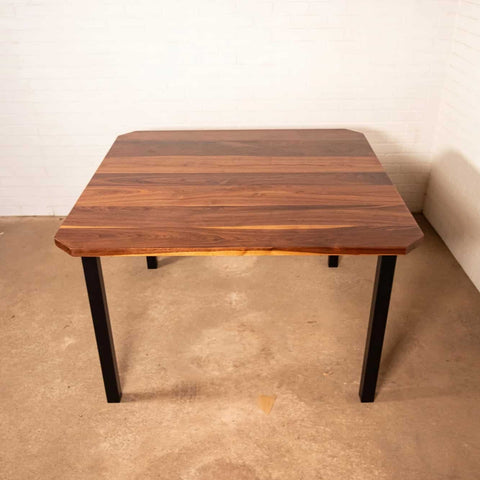 Primrose legs under a square walnut table top