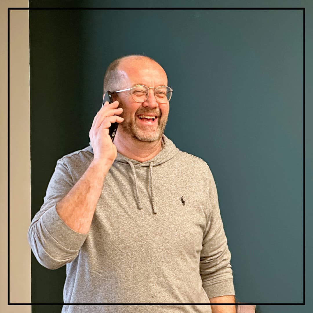 Ted on the Phone talking about a Dining Table