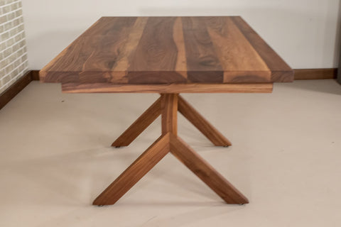 yoder table base in walnut under a walnut extendable table