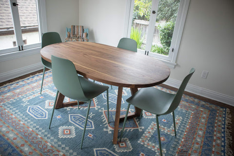 An Oval Dining Table made from Solid Walnut