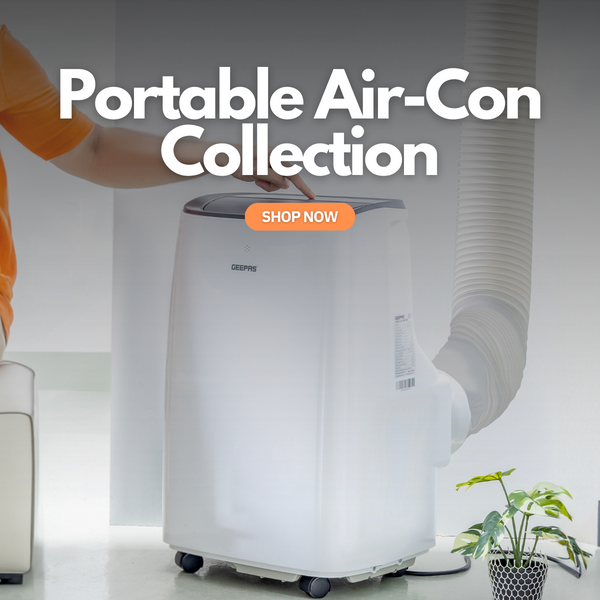 The image shows off a portable 7000btu air conditioning unit in an office with a person adjusting the settings