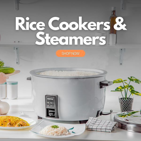 A large 4L electric rice cooker and steamer on top of a kitchen countertop with ready rice inside and a few other dishes around it.