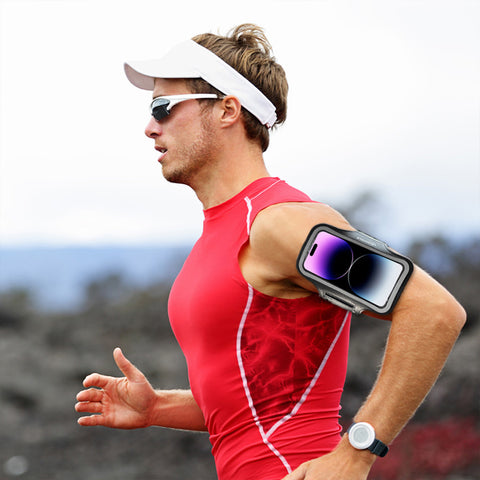 Male jogger wearing a phone armband