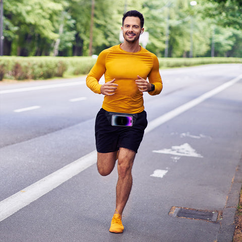 Male runner on a road wearing a waist pack