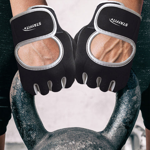 Athlete wearing fitness gloves holding a metal kettlebell