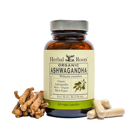 Bottle of Herbal Roots Organic Ashwagandha with capsules on the right of the bottle and ashwagandha roots on the left.