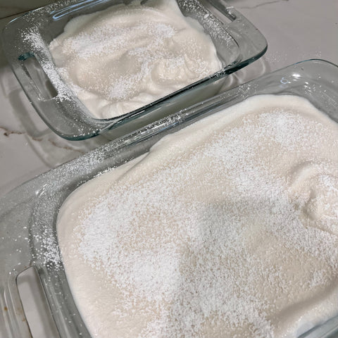 Two baking pans of marshmallow