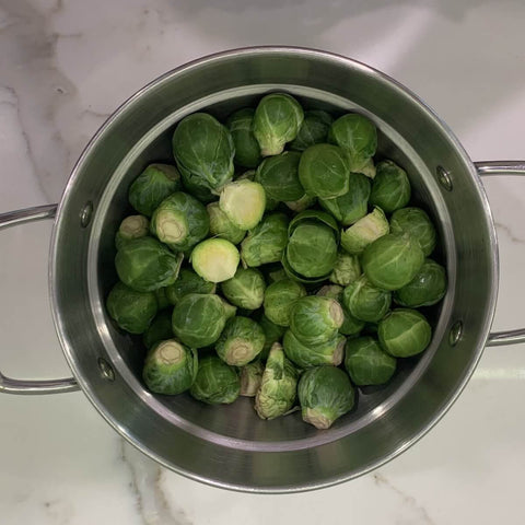 Brussel sprouts in a pot.