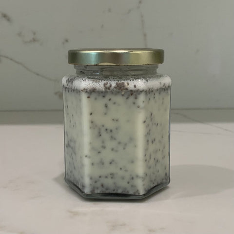 Oat milk, agave with chia seeds in a glass container.