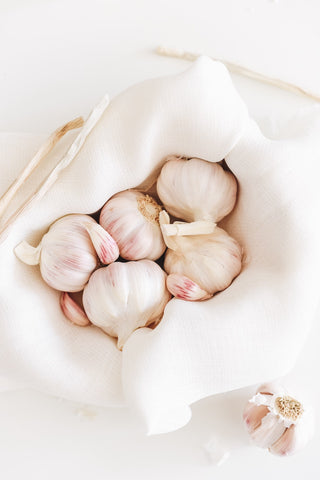 Garlic bulbs in a white basket