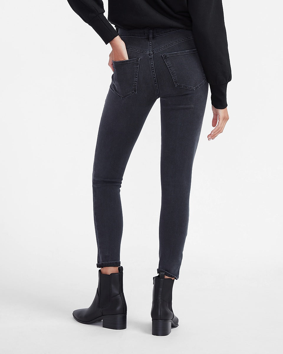 Express | High Waisted 4-Way Hyper Stretch Black Ripped Skinny Jeans in ...