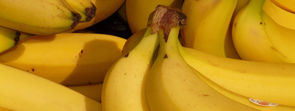 a collection of yellow bananas
