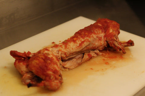 cooked rabbit on cutting board
