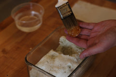 brushing salt off cured egg yolk