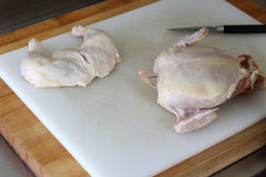 chicken wishbone coming out of raw chicken 
