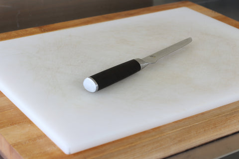 Shun boning knife on cutting board