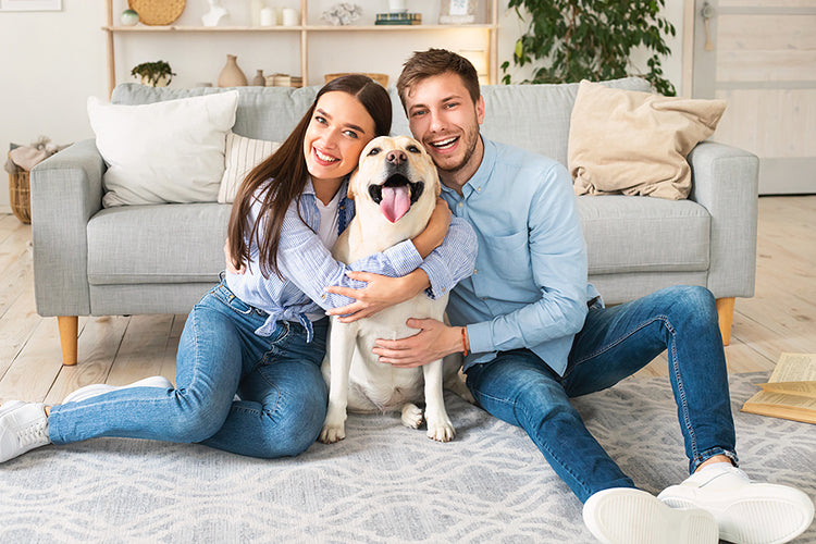 happy couple with dog