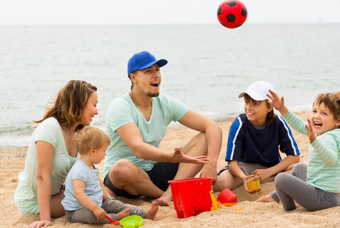 Family with kids at the beach